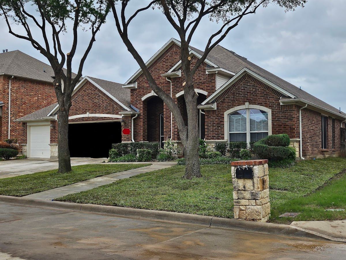 Tidy Fort Worth brick home with mature shade trees and a freshly cleaned-up front lawn